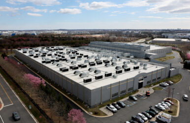 A car drives past a building of the Digital Realty Data Center in Ashburn, Virginia, U.S., March 17, 2025. REUTERS/Leah Millis/File Photo