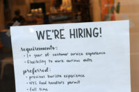 A hiring sign is seen in a cafe as the U.S. Labor Department released its July employment report, in Manhattan, New York City, U.S., August 5, 2022. REUTERS/Andrew Kelly