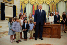 Children pose with U.S. President Donald Trump during an event to mark the launch of "Trump Accounts" in the Oval Office at the White House in Washington, D.C., U.S., July 6, 2026. REUTERS/Evan Vucci