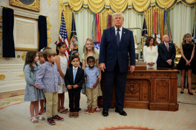 Children pose with U.S. President Donald Trump during an event to mark the launch of "Trump Accounts" in the Oval Office at the White House in Washington, D.C., U.S., July 6, 2026. REUTERS/Evan Vucci