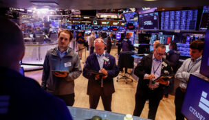 Traders work on the floor of the New York Stock Exchange (NYSE), in New York City
