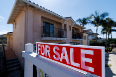FILE PHOTO: A residential home for sale sign is shown in California