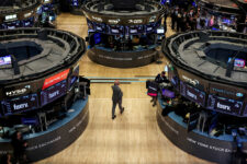 Traders work on the floor at the New York Stock Exchange (NYSE) in New York City, U.S., April 3, 2025. REUTERS/Brendan McDermid/File Photo