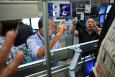 Traders work on the floor of the NYSE in New York