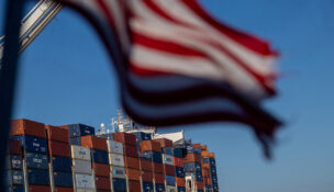 FILE PHOTO: A cargo ship full of shipping containers is seen at the port of Oakland, California