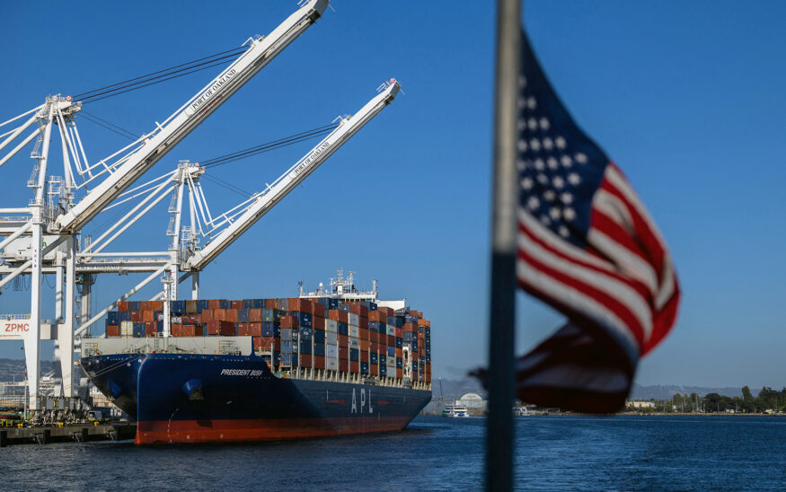 A cargo ship full of shipping containers is seen at the port of Oakland, California