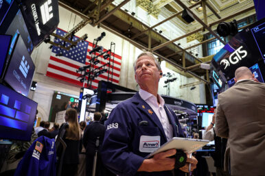 Traders work on the floor of the NYSE in New York