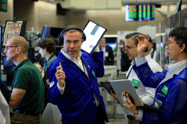 Traders work on the floor of the NYSE in New York