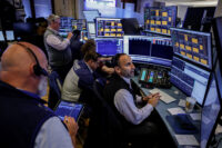 Traders work on the floor of the New York Stock Exchange (NYSE) in New York City