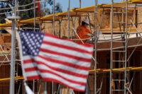A construction worker is shown at work on a multi-unit residential housing project in Encinitas, California, U.S., July 28, 2025. REUTERS/Mike Blake/File Photo