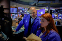 Traders work on the floor of the New York Stock Exchange (NYSE) in New York City