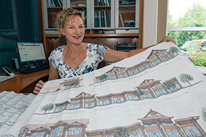 Developer Kathy Owens holds plans for Asia Town, a project she wants to build with funding through the EB-5 program.