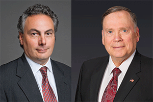 Tony Moraco (left), CEO of SAIC; and John Jumper, Chairman and CEO of Leidos