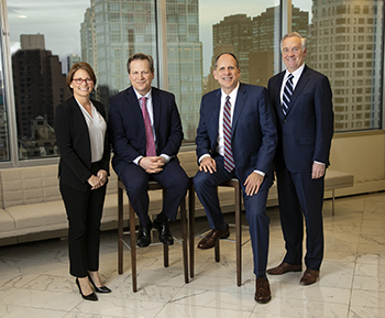 Andrea Farley, chair of Troutman Pepper's Partner Compensation Committee; Tom Cole, managing partner; Steve Lewis, chair and CEO; and Tom Gallagher, vice chair. 