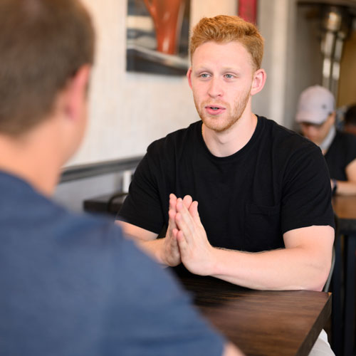 Recent U.Va. graduate Myles McPartland went from a self-described “shy kid” to directing 250 volunteers in a university nonprofit program that helps local low-income families with preparing and filing their income taxes. Photo by Will Schermerhorn