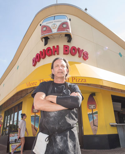  “It’s a nightmare,” says George Kotarides, who has struggled this summer to find workers for his three Dough Boy’s Pizza restaurants on Virginia Beach’s Oceanfront. Photo by Mark Rhodes