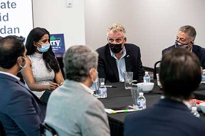 Former Gov. Terry McAuliffe visited Granules Pharmaceuticals during a campaign stop in Chantilly on Aug. 26. L to R: Granules Pharmaceuticals CEO Priyanka Chigurupati; McAuliffe; and David-Imad Ramadan, a former Republican member of the Virginia House of Delegates.