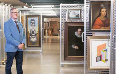 Chrysler Museum of Art Director and CEO Erik Neil stands in a third-floor art storage area, where works are safe from flooding. Photo by Mark Rhodes