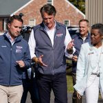 (L to R, foreground) Virginia Attorney General-elect Jason Miyares, Gov.-elect Glenn Youngkin and Lt. Gov.-elect Winsome Sears led a red wave in the November 2021 elections that saw the GOP regain control of the House of Delegates. Photo by Associated Press/Steve Helber