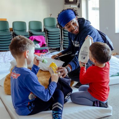 Operation Blessing staff member Tony Batchler Jr. entertains young Ukrainian refugees at a church in Poland. Photo courtesy Operation Blessing