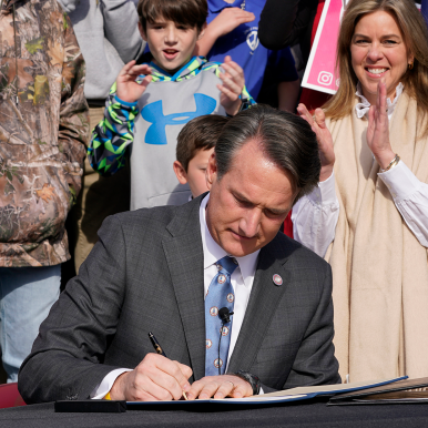 Virginia Gov. Glenn Youngkin signed a bill banning mask mandates in public schools in Virginia during a Feb. 16 signing ceremony on the steps of the State Capitol. Photo by AP Images/Steve Helber 